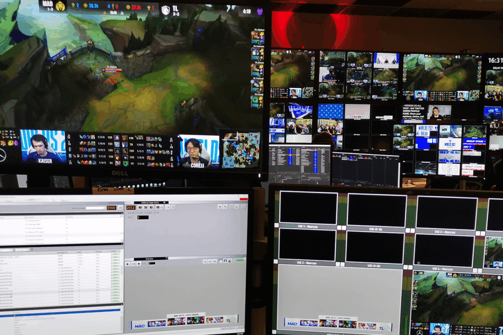 A desk equipped with multiple screens and a computer, showcased at the League of Legends Show in Berlin with VIZ Trio.